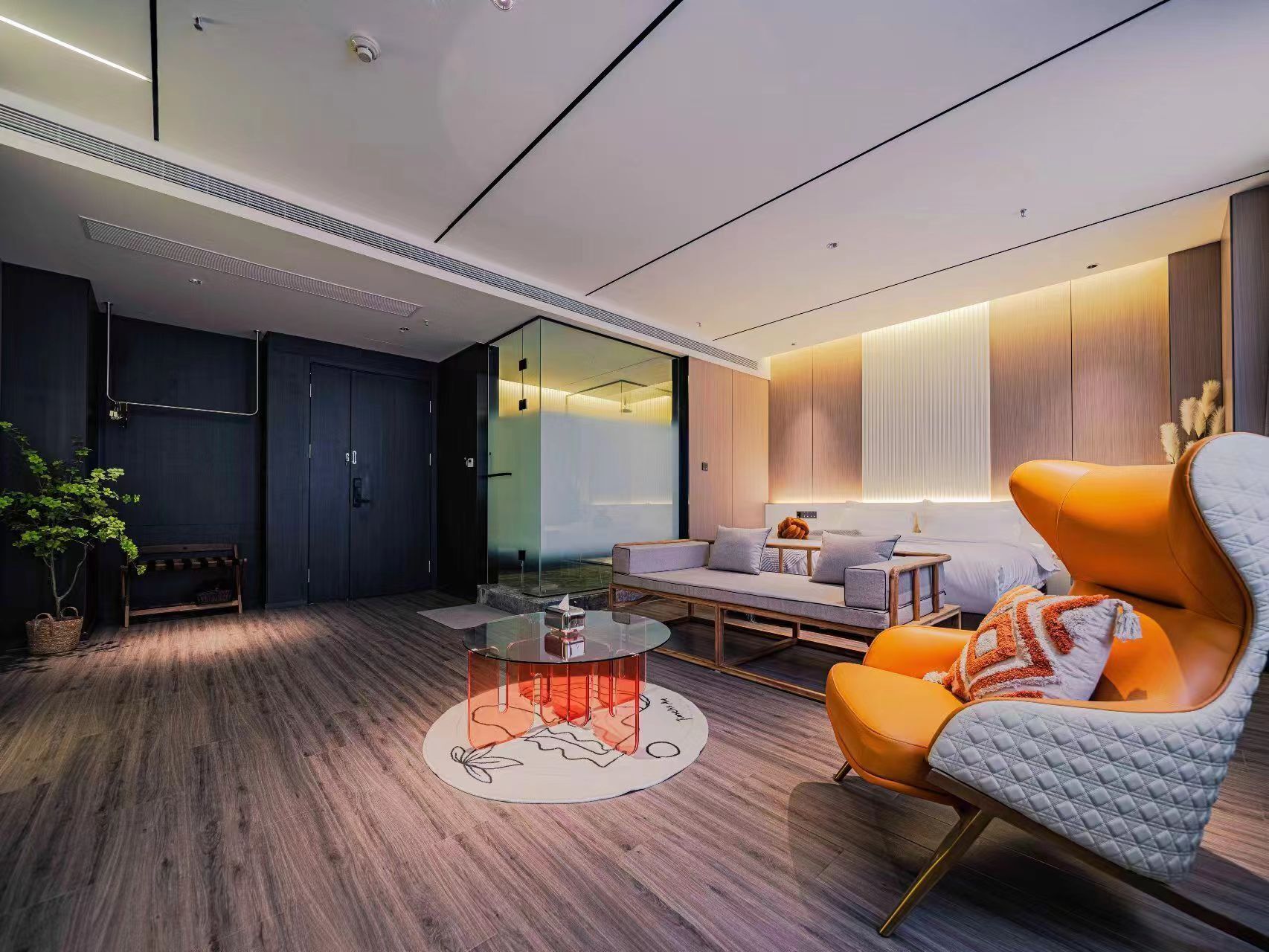 A modern living room with a sofa, armchair, and coffee table.