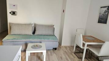 Apartamento, 1 quarto, para não fumantes, sacada | Área de estar