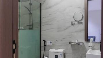 Separate bathtub and shower, free toiletries, hair dryer, slippers