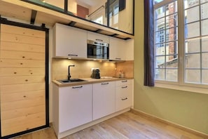 Departamento, vista a la ciudad | Cocina privada