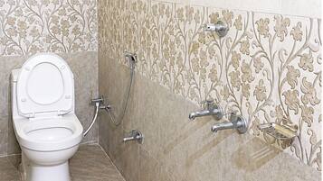 Shower, rainfall showerhead, slippers, towels