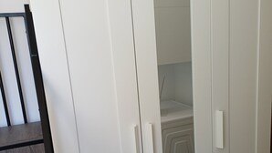 A white wardrobe with two doors and a mirrored section. - Victor's House at the Foot of Sainte Victoire (Vauvenargues)
