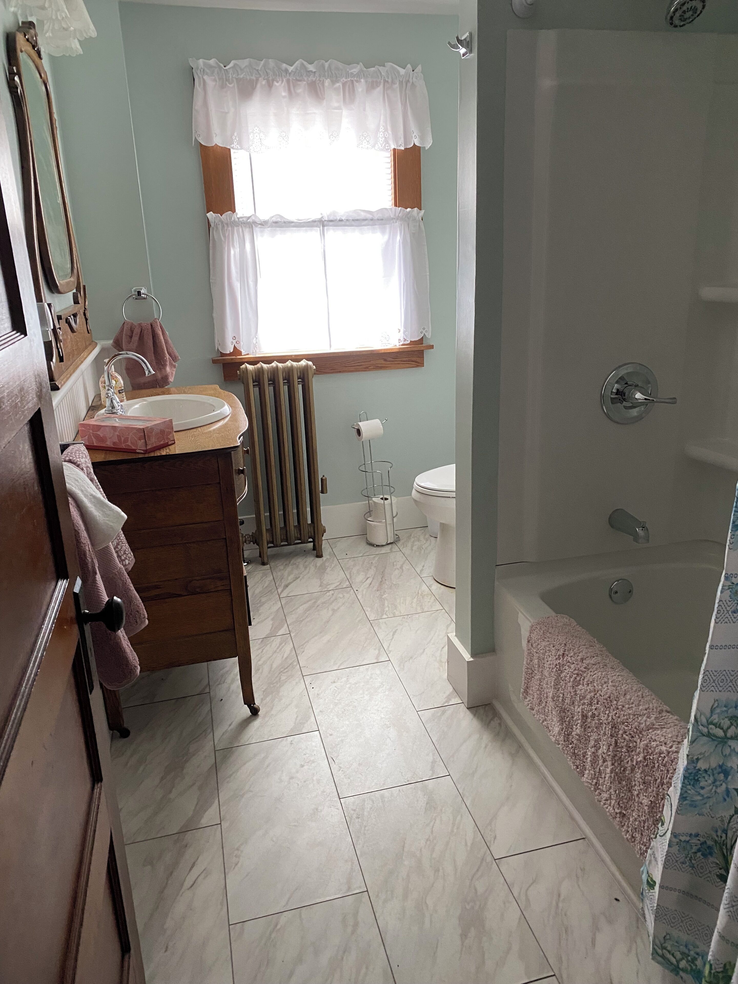 A bathroom with a sink, toilet, and bathtub.