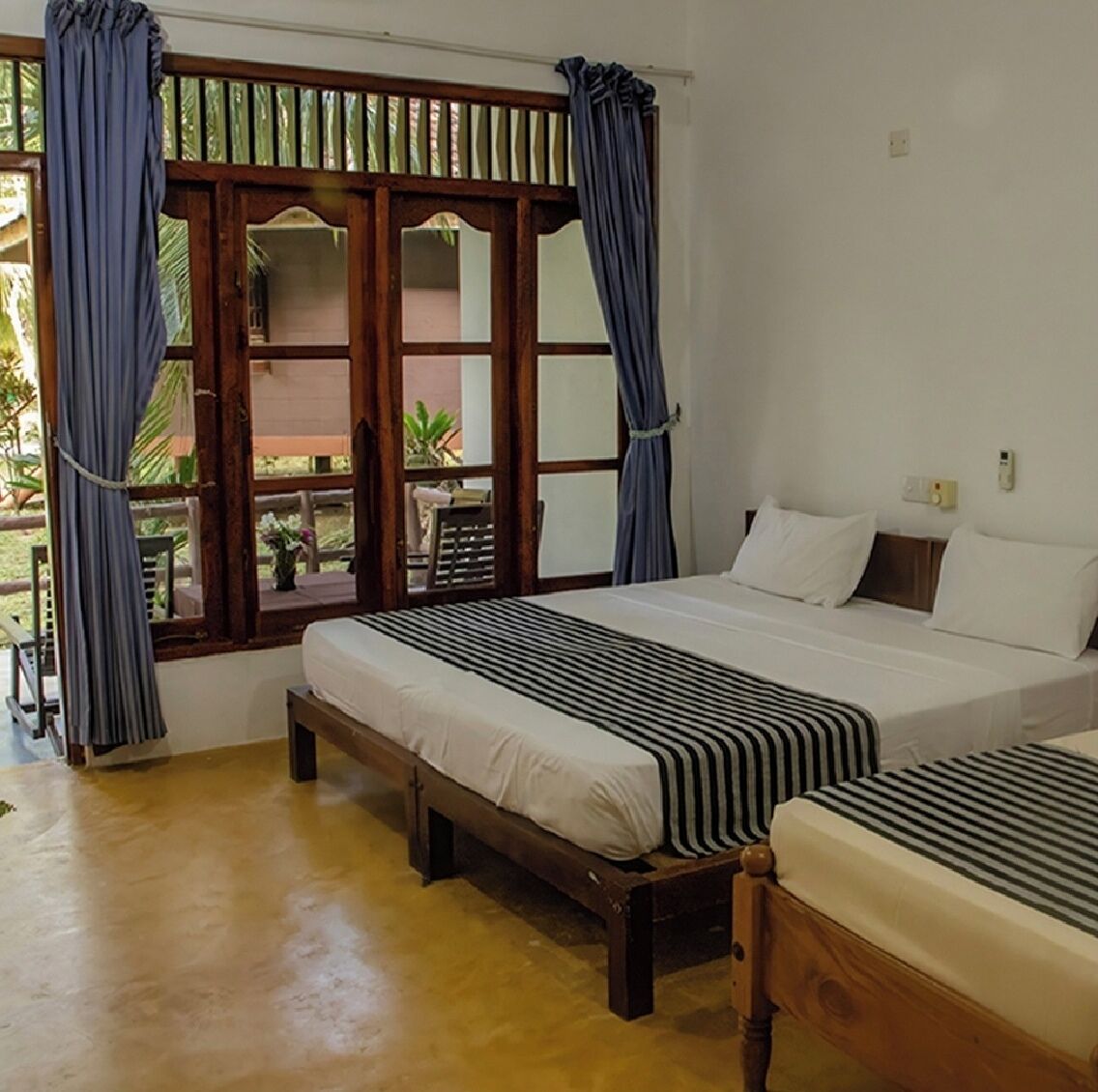 Quarto triplo luxo, vista para o jardim | Escrivaninha, Wi-Fi de cortesia