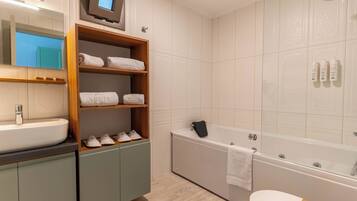 Family Studio Suite, Sea View | Bathroom | Combined shower/bathtub, hair dryer, slippers, towels