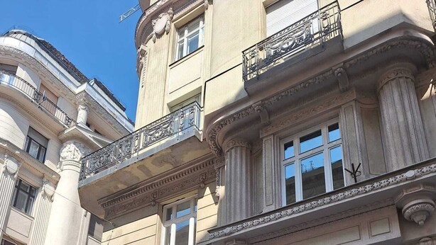 A hotel facade with a classical architectural style, featuring ornate balconies and large windows. - THE 8 HOTEL BUDAPEST (Budapest)