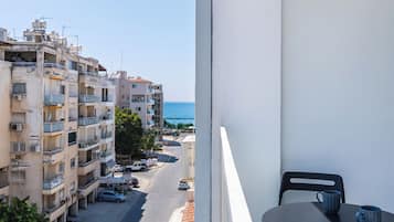 Apartment, Balcony, Beach View | Outdoor dining