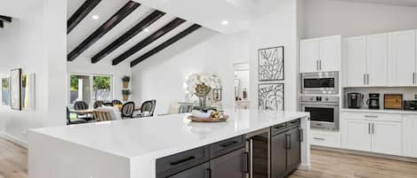 Modern fully equipped kitchen with generous counter space.