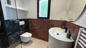 Shower, hair dryer, towels, toilet paper