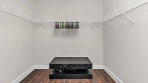 A laundry area with a metal drying rack and a black marble countertop. - Oyster Cove: Pets Allowed, Grill, Pong, Beach! (Navarre)