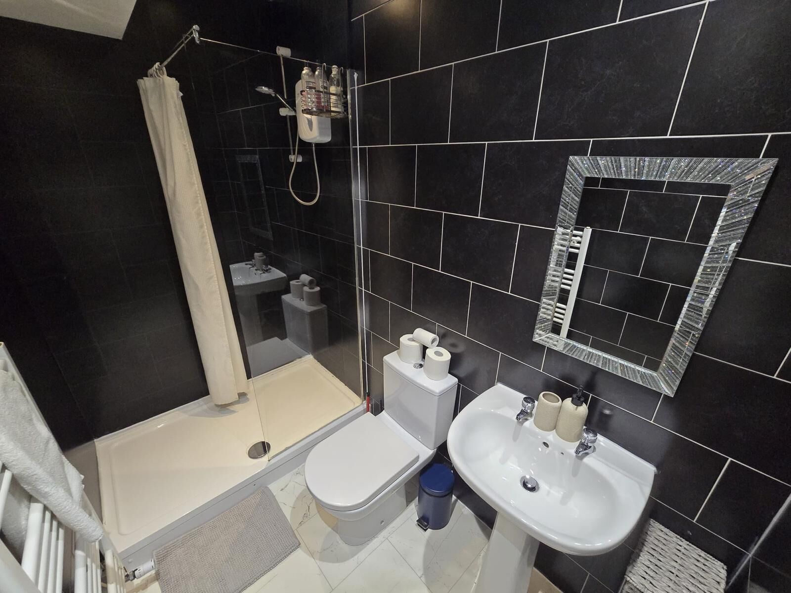 Shower, hair dryer, towels, soap