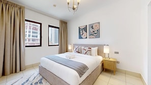 A hotel room with a bed, two windows, a nightstand, and a lamp. - Arabian Style 1 Bed l Near to Dubai Mall (Downtown)