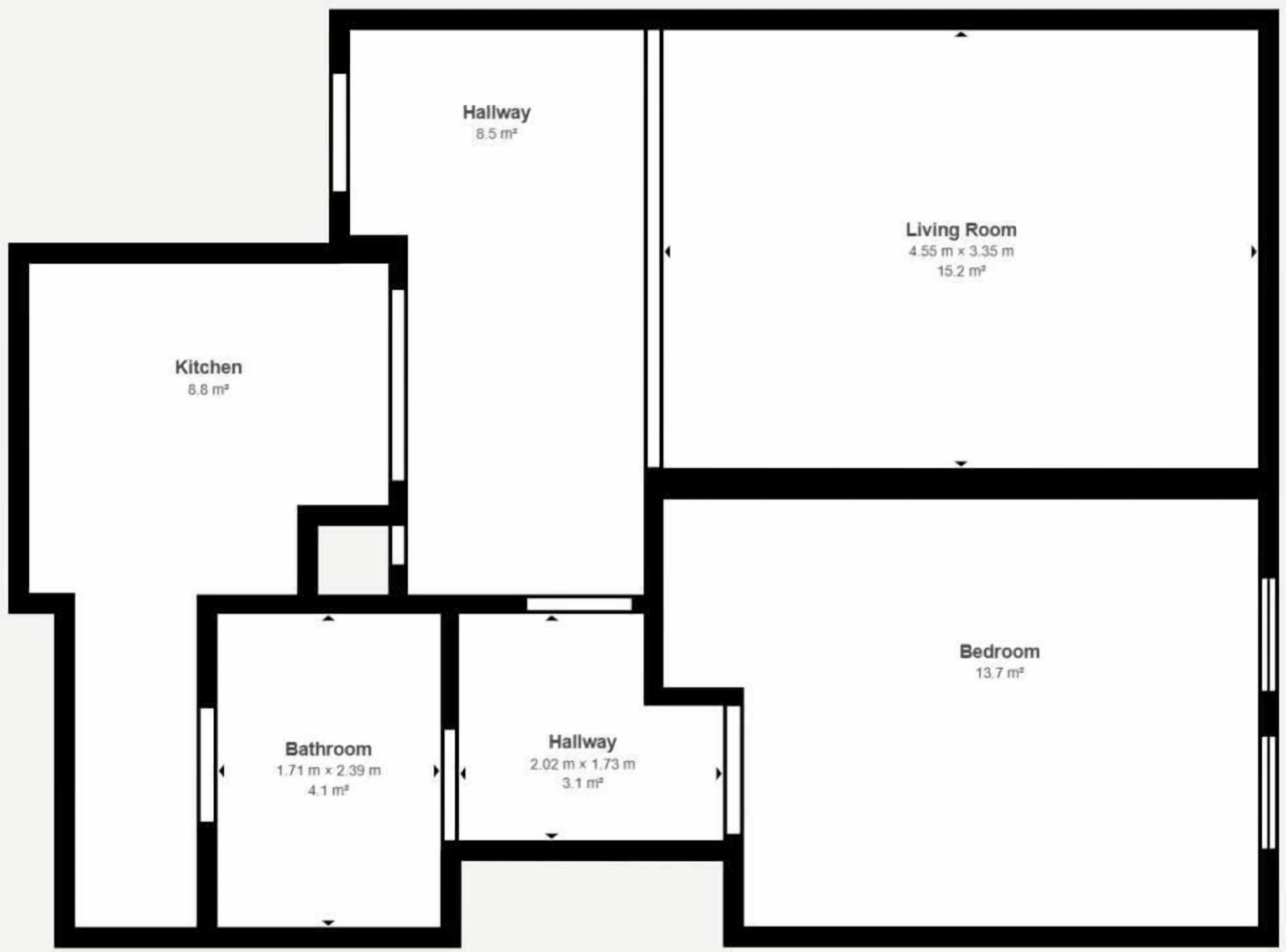 A floor plan with a kitchen, bathroom, living room, bedroom, and two hallways.