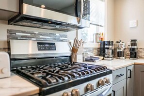 Coffee/tea maker, fridge, microwave, oven