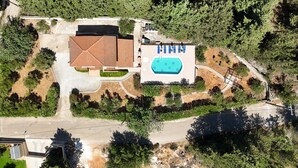 An aerial view of a property with a swimming pool, a covered patio, and a road. - Villa Oleander- with Private pool & Near the beach (Chania)