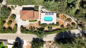 An aerial view of a property with a swimming pool, a covered patio, and a road. - Villa Oleander- with Private pool & Near the beach (Chania)