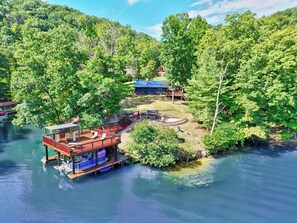 A lakeside property with a dock, a covered deck, and a cabin. - Luxury,  Private Dock, hot tub, Claytor Lake Front.  VA tech, Radford University (Radford)