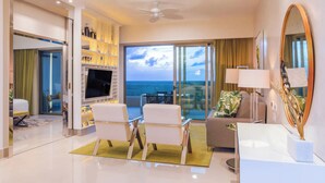 A modern hotel room with a balcony, a flat-screen TV, and a large mirror. - 5-Star Luxury Resort with Oceanfront Suite @ Garza Blanca [Dec 26 - Jan 2] (Cancun)