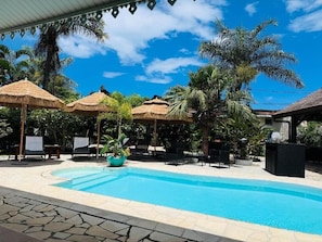 Outdoor pool, open 9:00 AM to 6:00 PM, pool umbrellas, pool loungers