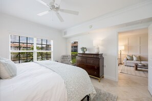 A bedroom with a bed, dresser, and a ceiling fan. - Newly Remodeled Naples Retreat - Resort-Style Living at Bridgewater Bay (Naples)