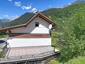 A small white building with a brown roof, a satellite dish, and a small window. - Resimini by Interhome (Pettneu am Arlberg)