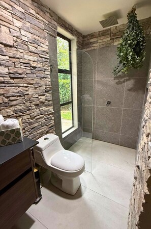Shower, towels, soap, toilet paper