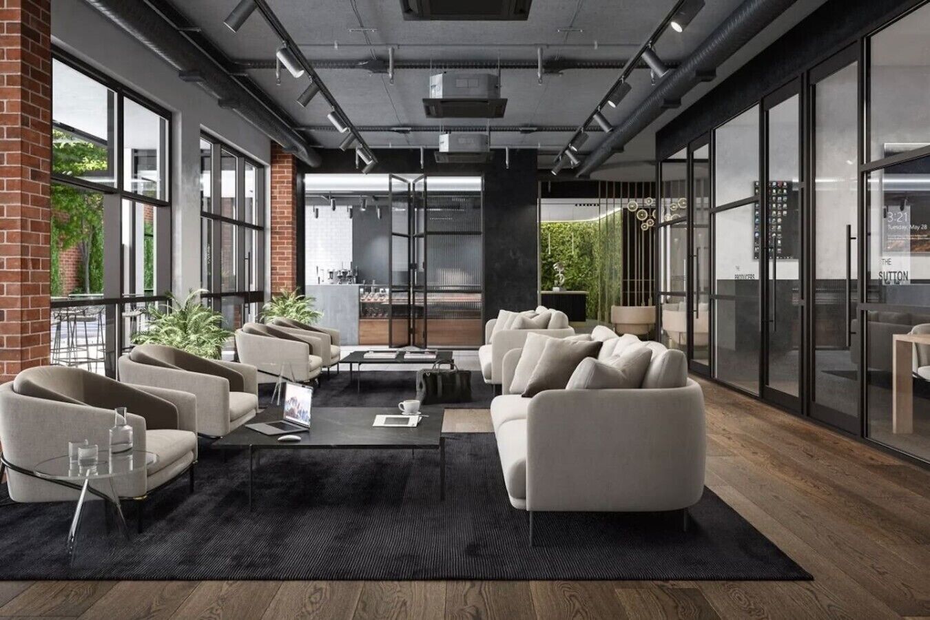 A modern lounge area with sofas, a coffee table, and a view of the outdoor seating area.