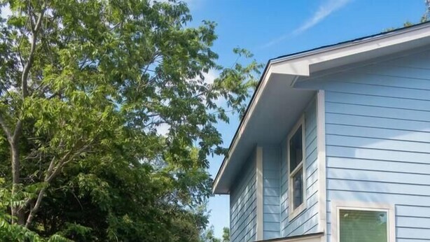 A two-story house with a covered driveway and a parked car. - East Austin, Walkable, Private Hot Tub and Parking (Austin)