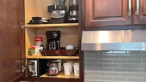 A kitchen with a coffee maker, a blender, and a toaster on the shelves. - Westside light and bright Guesthouse. Private entrance, this is NOT a basement (Idaho Falls)
