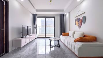 Luxury Apartment, 1 Bedroom, Balcony, City View | Living area | 55-inch Smart TV with digital channels
