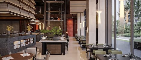 A modern restaurant interior with a long counter, seating area, and large windows.
