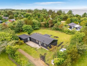A modern two-story house with a large front yard and a view of the sea. - "Jonnhild" - 100m to the fjord by Interhome (Tarm)
