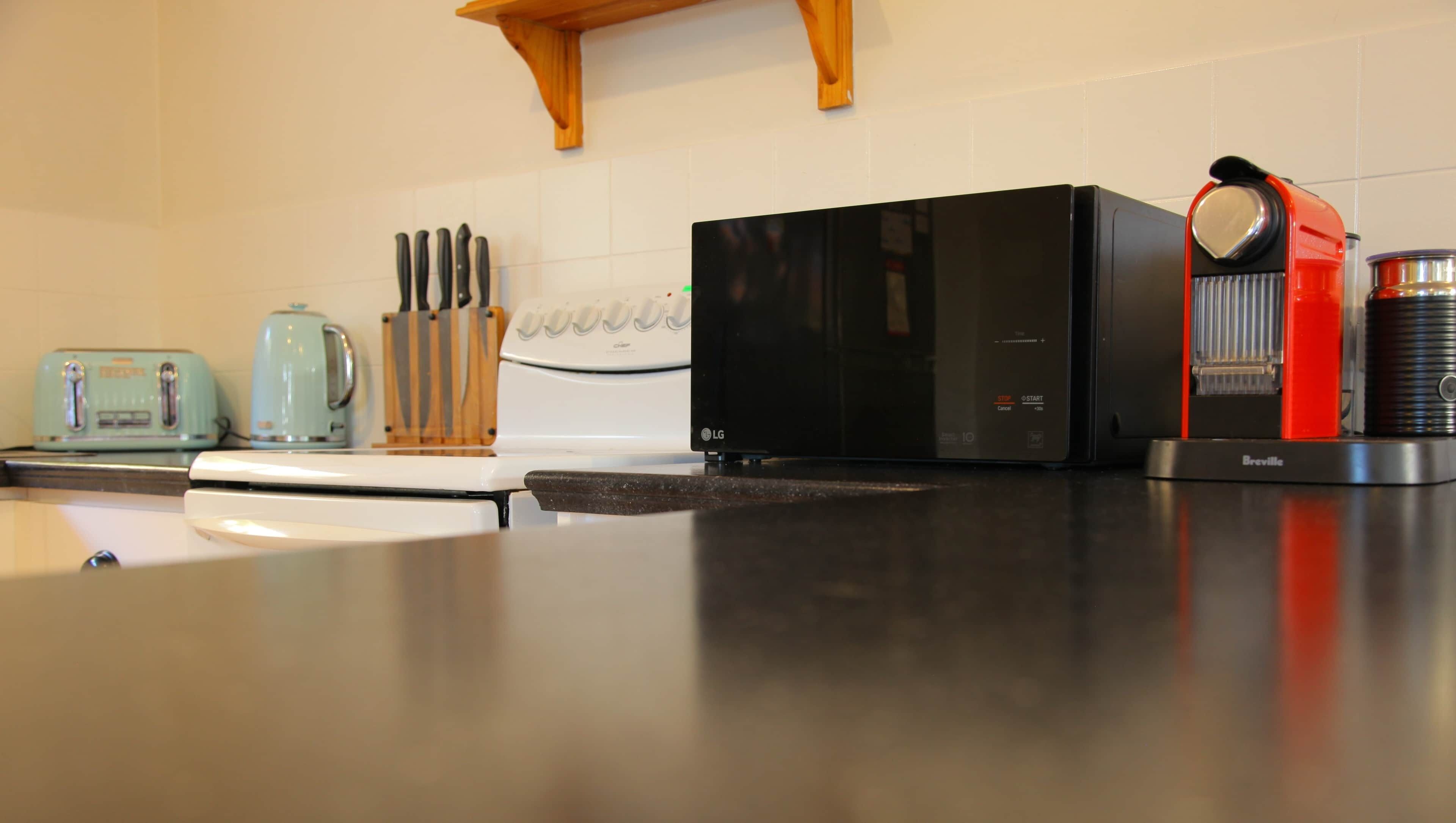 Coffee/tea maker, fridge, microwave, oven