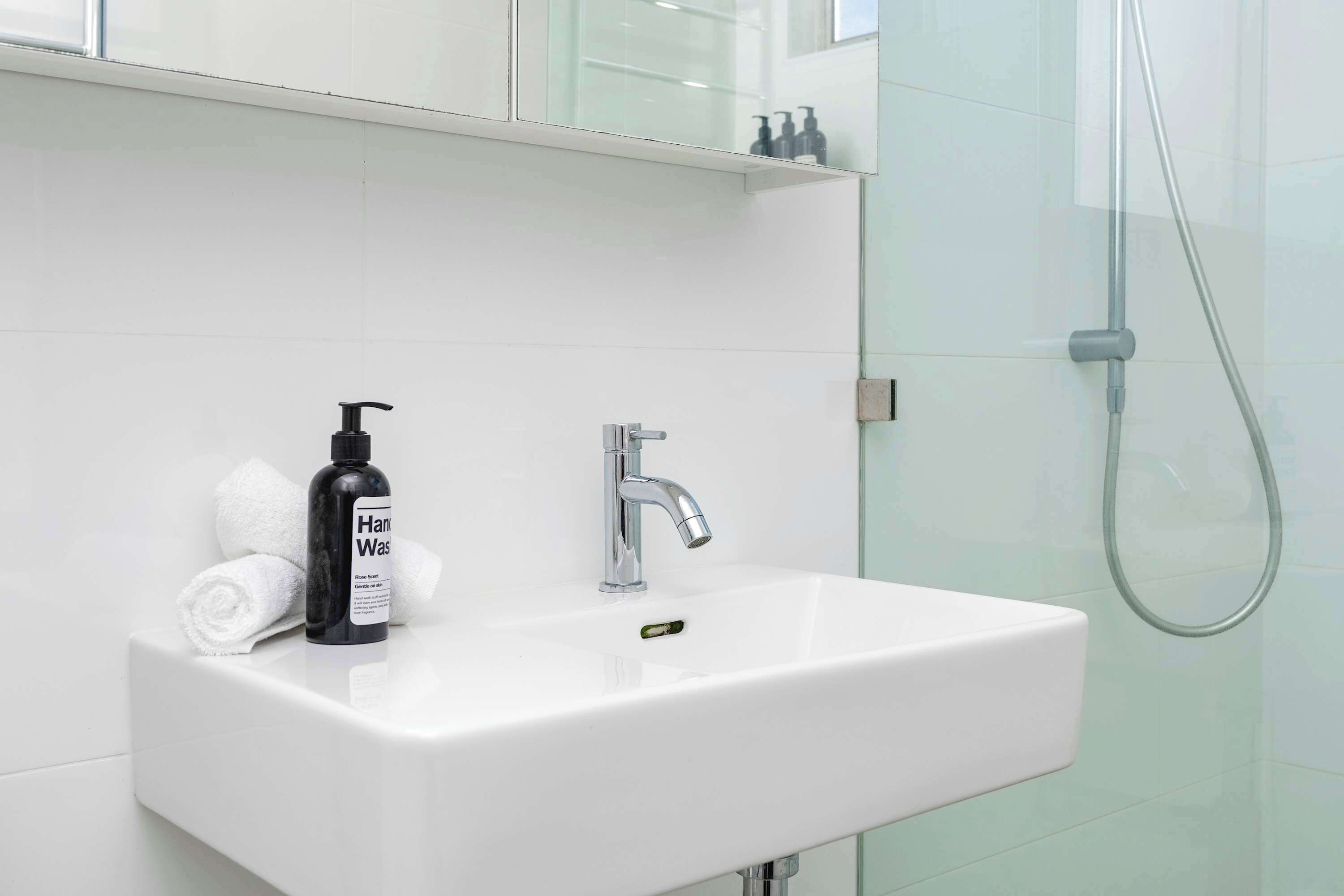 Shower, hair dryer, towels, shampoo