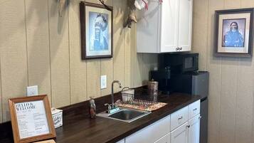 Coffee/tea maker, fridge, microwave, cookware/dishes/utensils