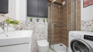Shower, hair dryer, towels, shampoo