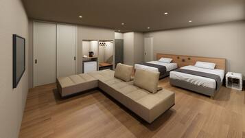 Habitación de hotel moderna con sofá seccional, dos camas individuales, una kitchenette pequeña y un vestidor.