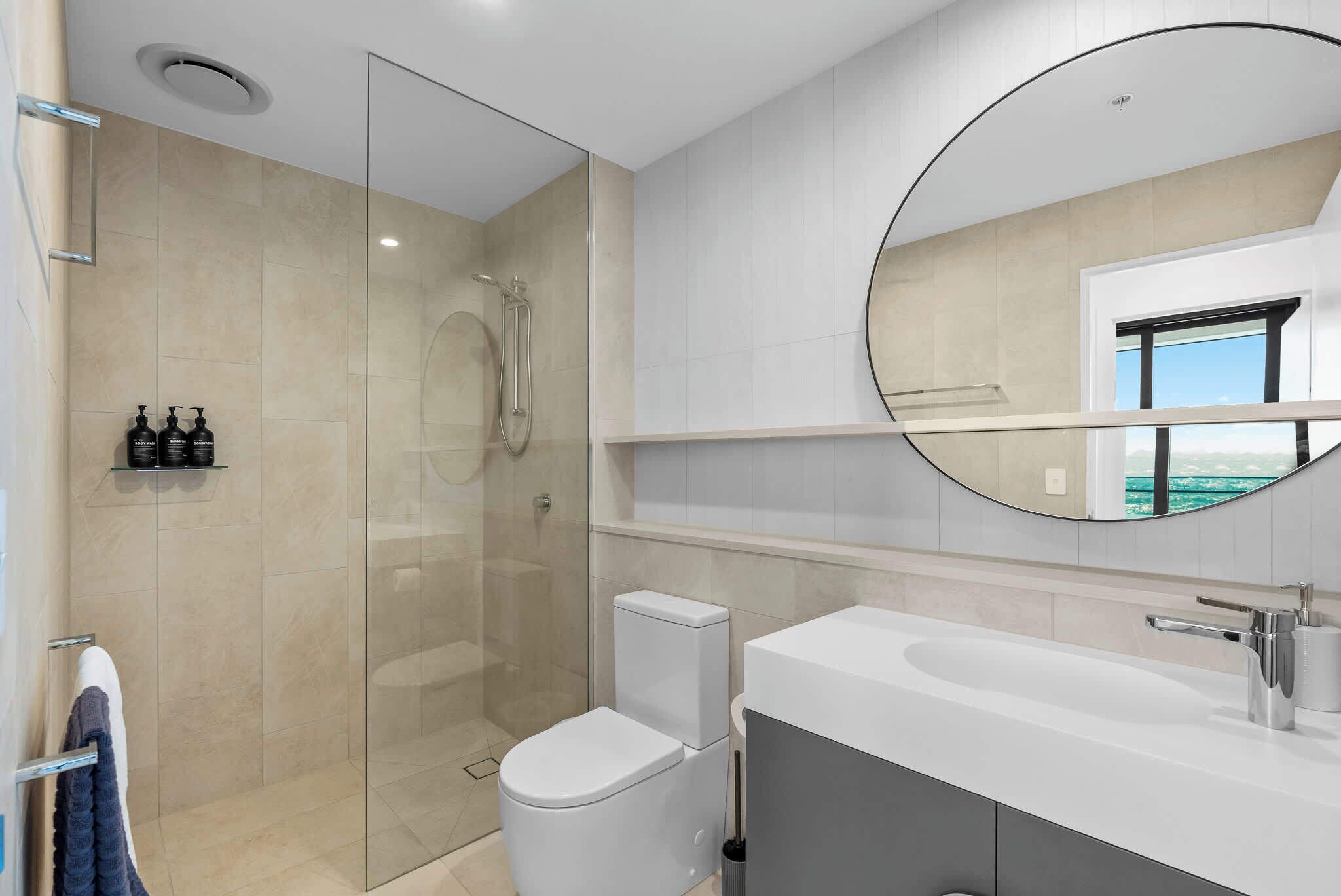 Shower, hair dryer, towels, shampoo
