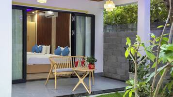 Quadrupla Deluxe, vista giardino | Una scrivania, Wi-Fi gratuito