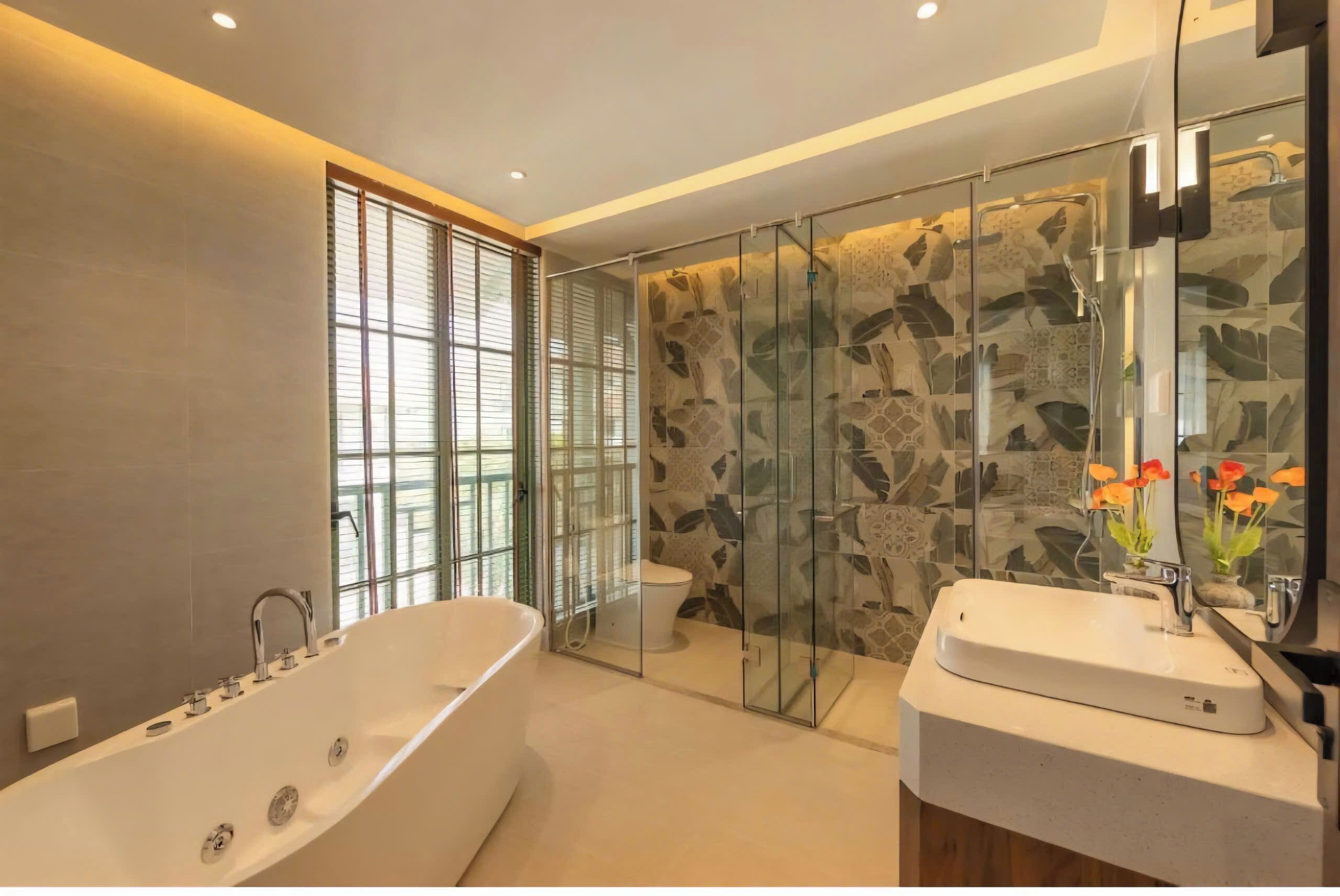A modern bathroom with a freestanding bathtub, a glass-enclosed shower, and a vanity with a mirror.