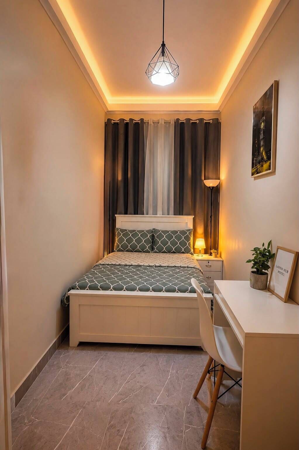 A bedroom with a bed, a desk, a chair, a lamp, a picture frame, and a potted plant.