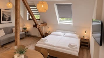 Suite estudio, 1 cama Queen size y sofá cama (3.6) | Escritorio, cortinas blackout y wifi gratis