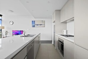 Private kitchen - Park View 2BR With Secure Parking | Near to Mall (Sydney Olympic Park)
