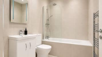 Shower, hair dryer, towels, shampoo
