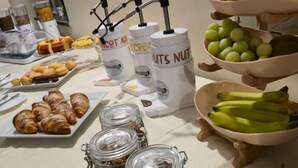 A breakfast buffet with various food items and condiments.