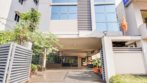A building entrance with a staircase leading up to a covered area. - Townhouse Dwarka Nagar Near Ramatalkies (Visakhapatnam)