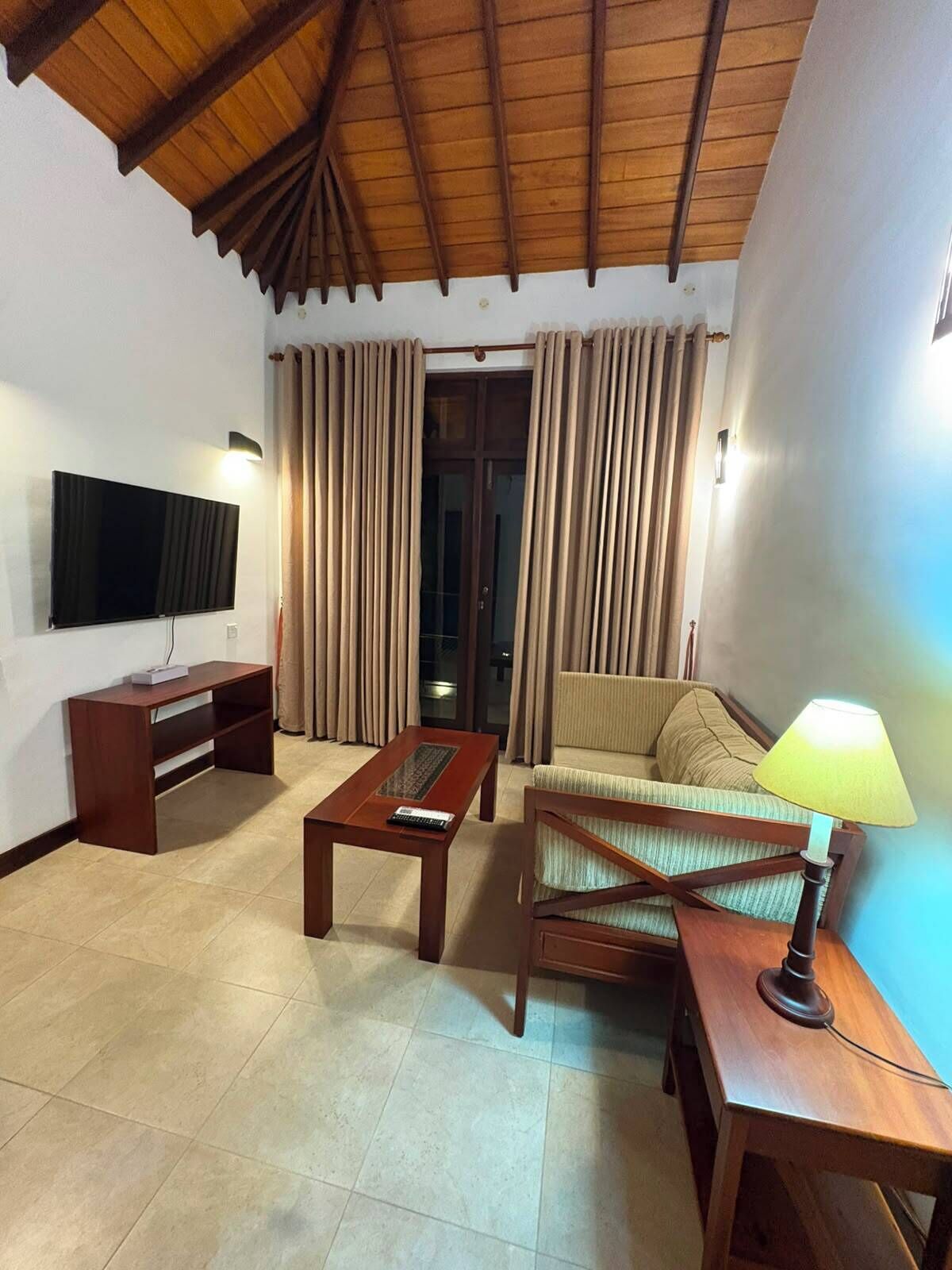 Deluxe Villa, Lagoon View | Living area | 55-inch Smart TV with cable channels, pay movies, computer monitors
