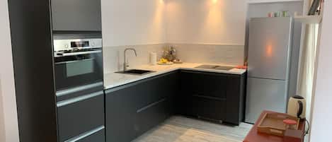 Coffee/tea maker, fridge, microwave, oven