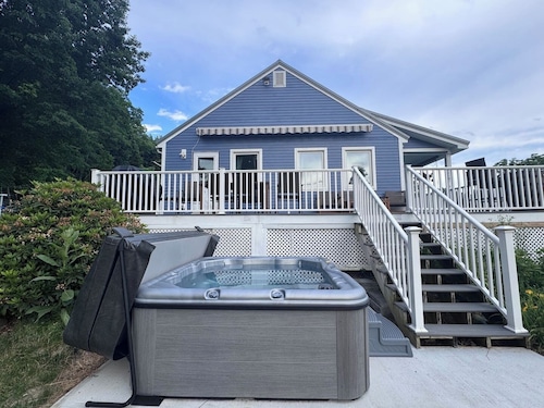 Relax at this pet-friendly Wine Trail retreat featuring a private hot tub, fire pit, spacious deck, and fenced yard. Minutes from wineries, breweries, waterfalls, scenic hikes, and Watkins Glen.