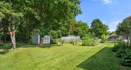 Relax at this pet-friendly Wine Trail retreat featuring a private hot tub, fire pit, spacious deck, and fenced yard. Minutes from wineries, breweries, waterfalls, scenic hikes, and Watkins Glen.